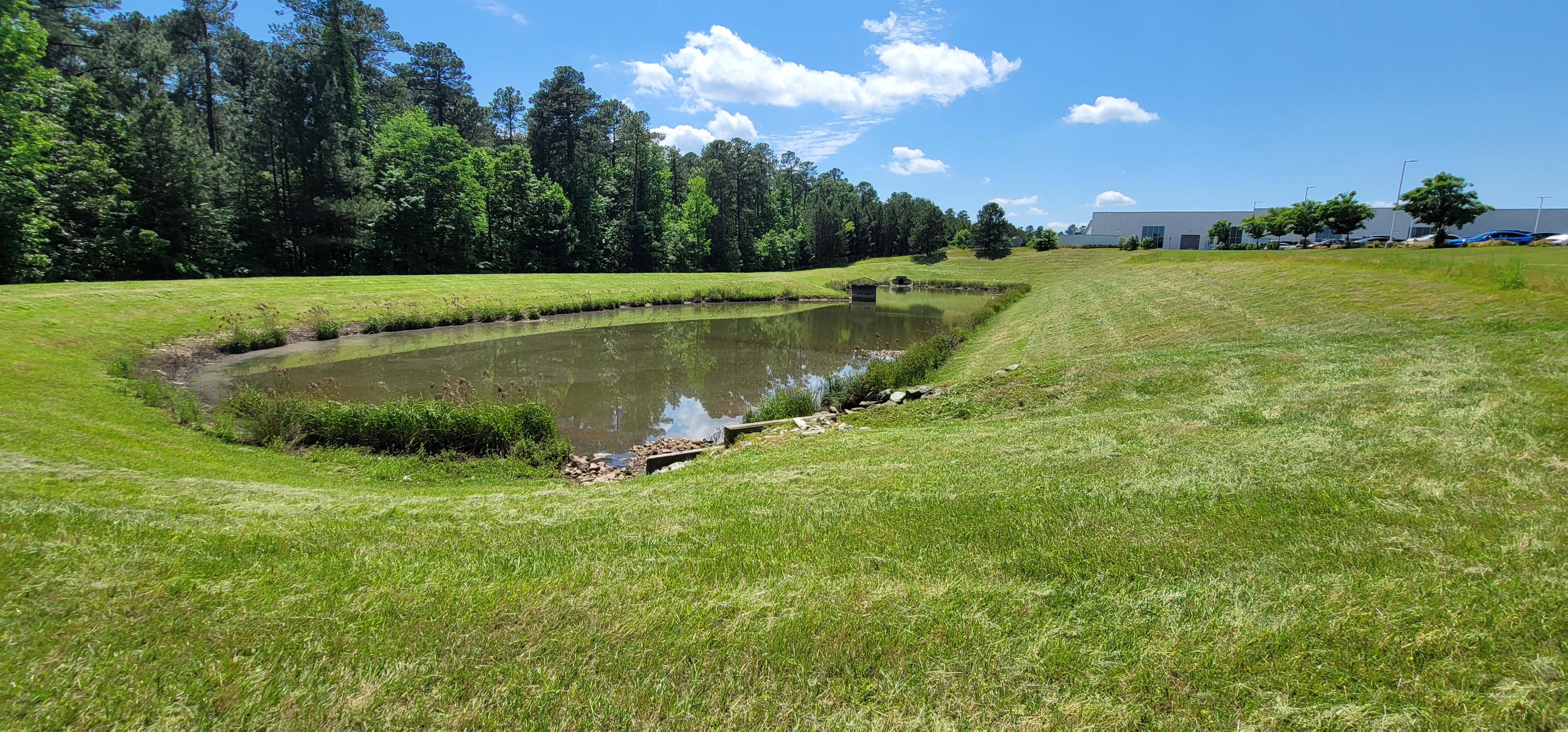 Professional stormwater services team maintaining stormwater control measures and drainage infrastructure