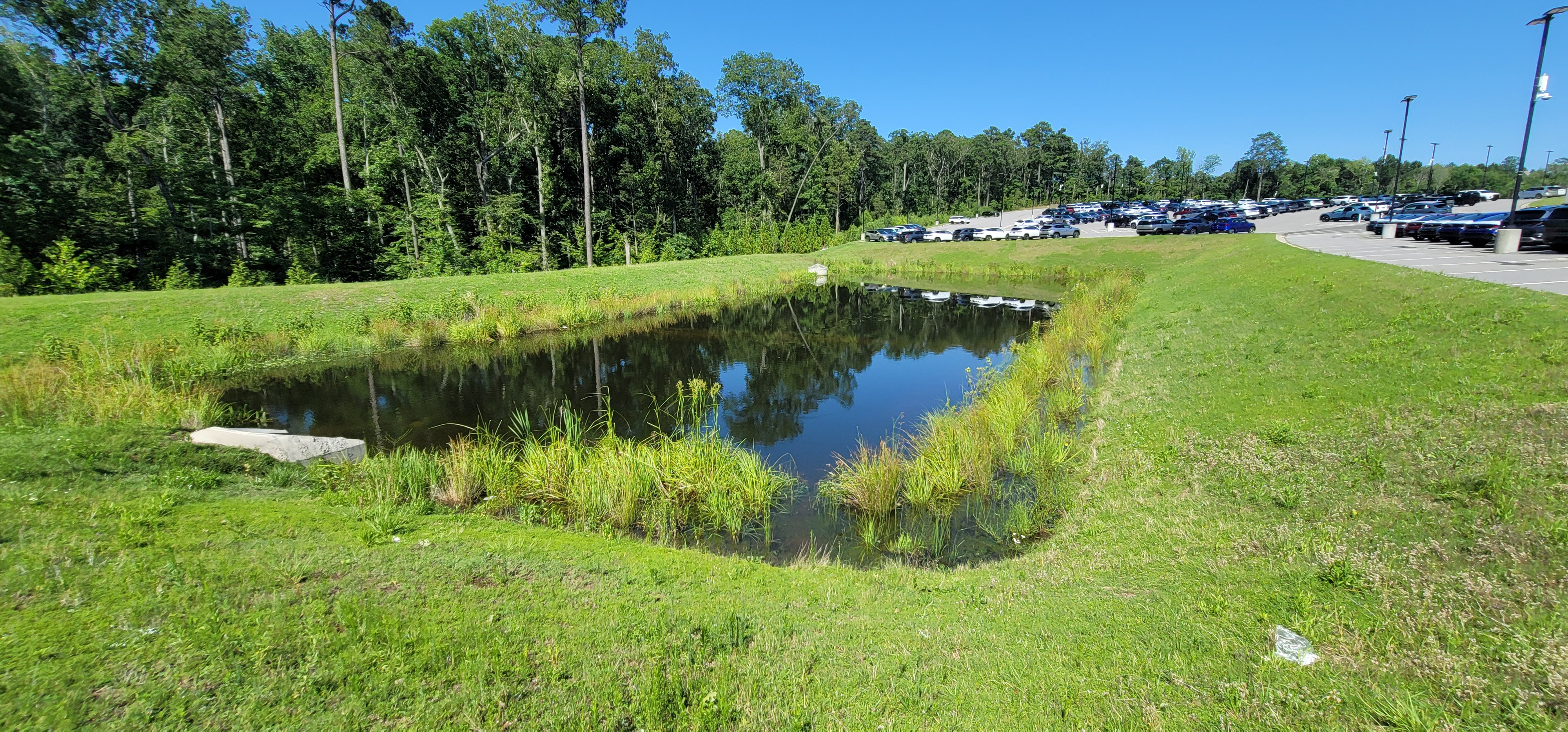 Stormwater retention pond with permanent pool for water quality treatment
